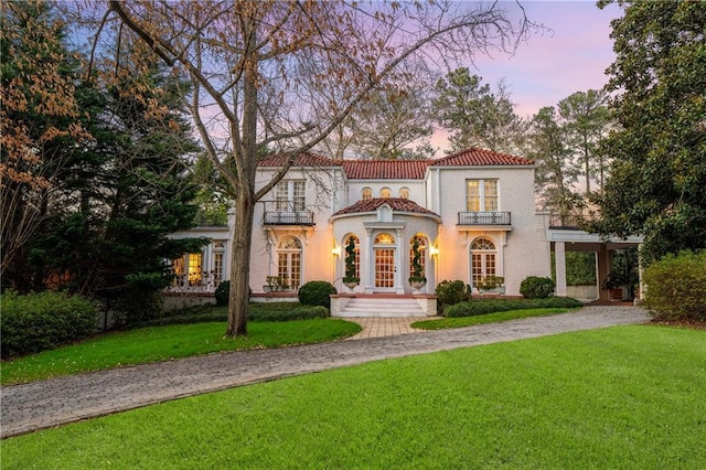 401 Peachtree Battle Ave NW, Atlanta, GA 30305 - mediterranean / spanish-style house featuring a balcony, a tiled roof, a yard, and french doors
