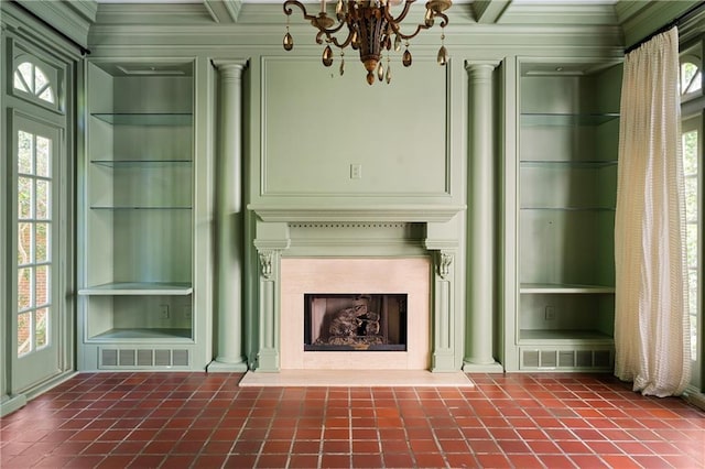 401 Peachtree Battle Ave NW, Atlanta, GA 30305 - unfurnished living room with decorative columns, built in shelves, plenty of natural light, dark tile patterned floors, and ornamental molding
