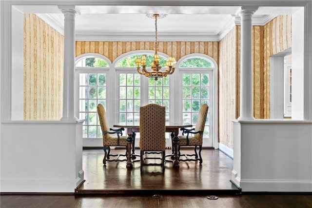 401 Peachtree Battle Ave NW, Atlanta, GA 30305 - dining room featuring wallpapered walls, baseboards, a chandelier, decorative columns, and wood finished floors
