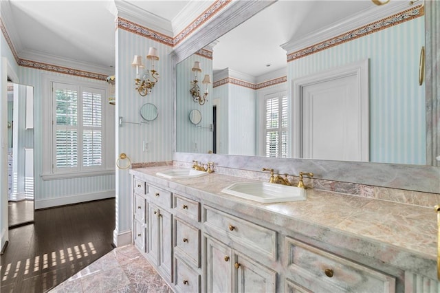 401 Peachtree Battle Ave NW, Atlanta, GA 30305 - bathroom featuring ornamental molding, healthy amount of natural light, double vanity, wood finished floors, and wallpapered walls