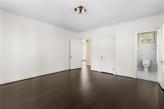 401 Peachtree Battle Ave NW, Atlanta, GA 30305 - unfurnished bedroom featuring dark wood finished floors, baseboards, ornamental molding, and ensuite bath