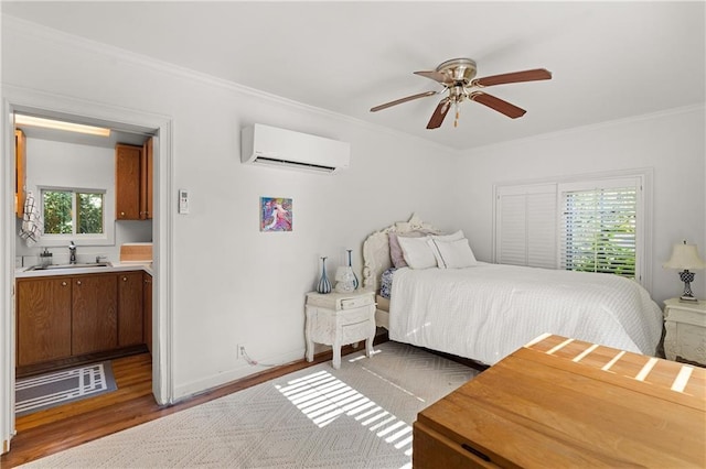 401 Peachtree Battle Ave NW, Atlanta, GA 30305 - bedroom featuring a sink, crown molding, wood finished floors, a wall mounted air conditioner, and baseboards