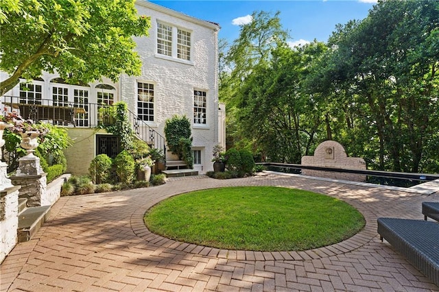 401 Peachtree Battle Ave NW, Atlanta, GA 30305 - view of yard featuring an outdoor stone fireplace, a patio area, and curved driveway