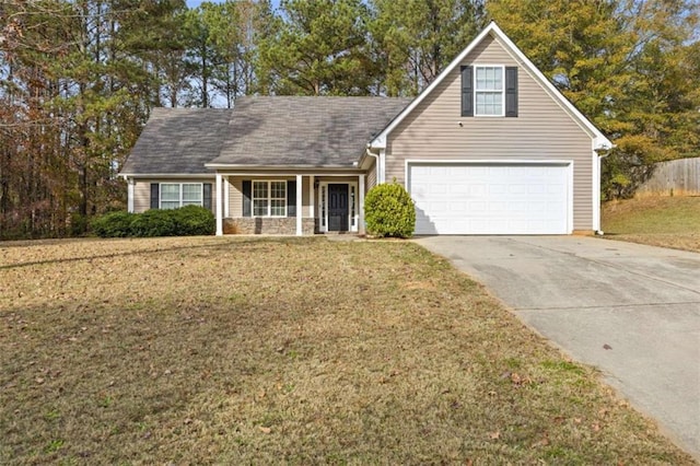 view of front of house featuring a front lawn and a garage