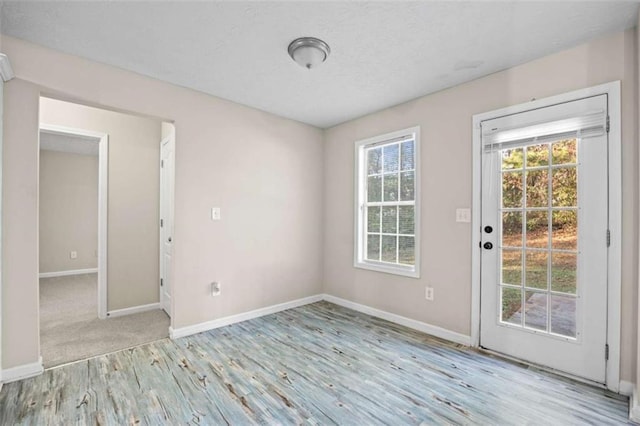 spare room featuring light hardwood / wood-style floors