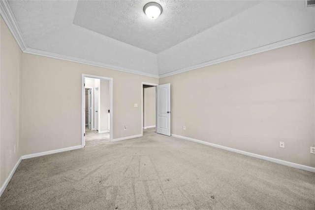 unfurnished bedroom featuring crown molding, a tray ceiling, carpet floors, and a textured ceiling