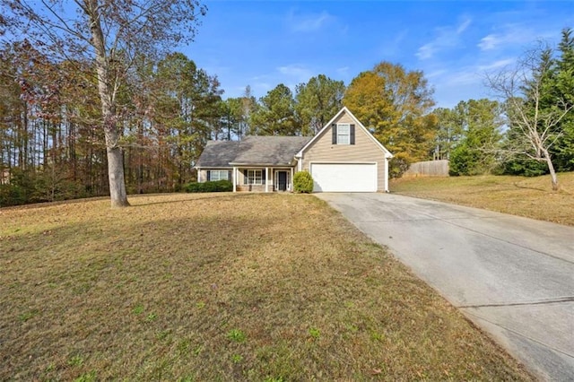 view of front facade featuring a garage and a front lawn