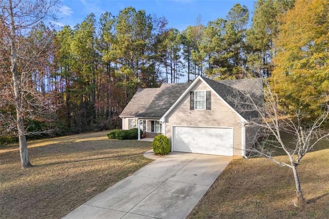 view of front of home featuring a garage and a front yard