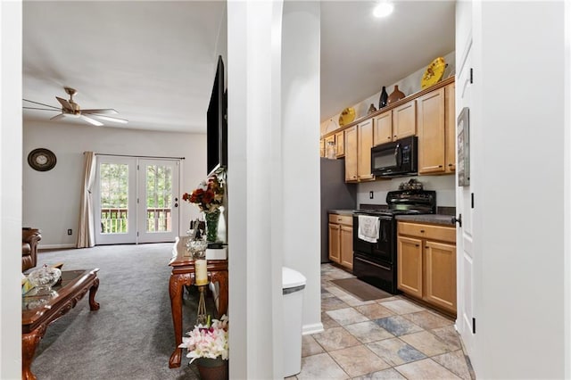 kitchen featuring ceiling fan, open floor plan, dark countertops, and black appliances
