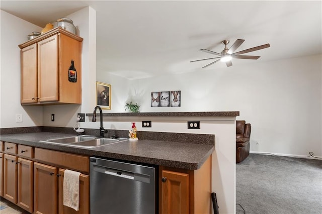kitchen with carpet floors, a ceiling fan, dark countertops, a sink, and dishwasher