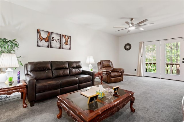 carpeted living room with baseboards and ceiling fan
