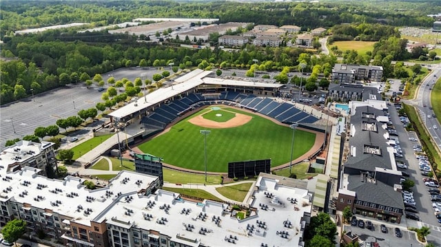 birds eye view of property featuring a wooded view