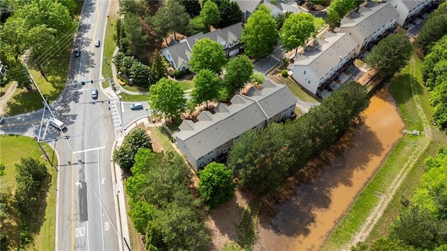 birds eye view of property with a residential view