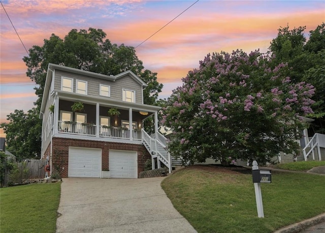 218 S Ave SE, Atlanta, GA 30315 - view of front of home featuring stairway, driveway, an attached garage, a porch, and brick siding