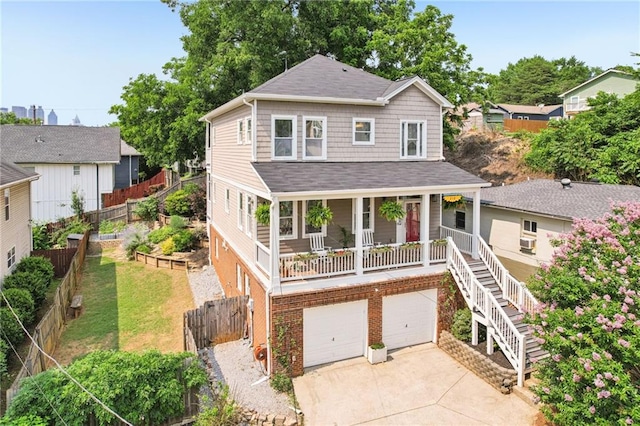 218 S Ave SE, Atlanta, GA 30315 - view of front of house with driveway, covered porch, a shingled roof, a garage, and stairway