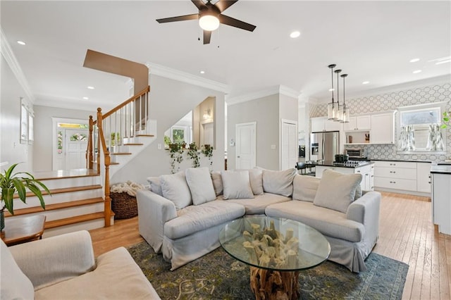 218 S Ave SE, Atlanta, GA 30315 - living room featuring stairs, crown molding, ceiling fan, recessed lighting, and light wood-style flooring