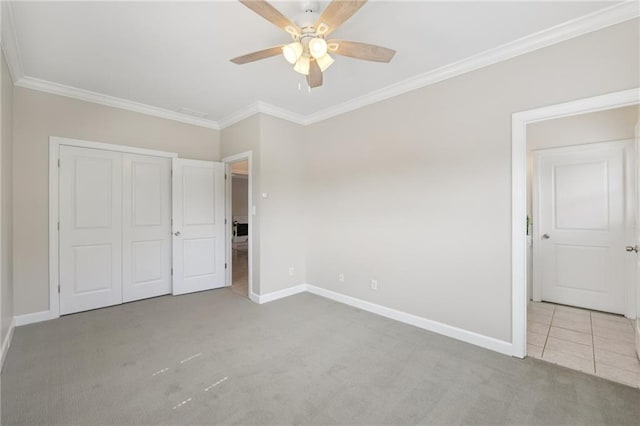 218 S Ave SE, Atlanta, GA 30315 - unfurnished bedroom featuring carpet floors, baseboards, crown molding, a closet, and ceiling fan
