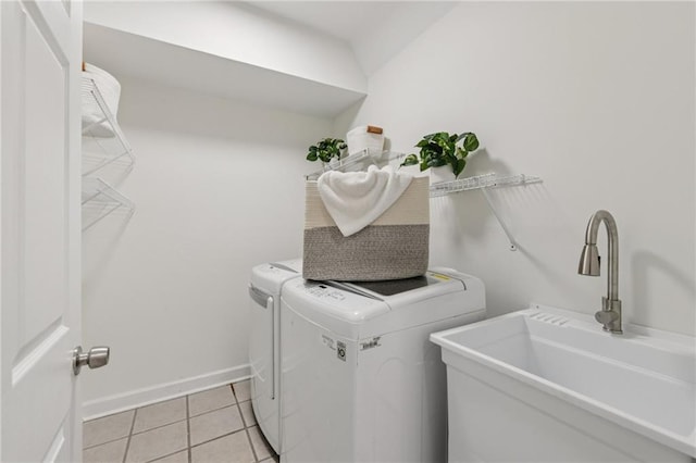 218 S Ave SE, Atlanta, GA 30315 - laundry area featuring washer and dryer, light tile patterned flooring, and baseboards