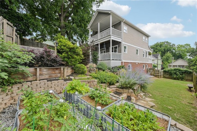 218 S Ave SE, Atlanta, GA 30315 - rear view of house featuring a vegetable garden and a balcony