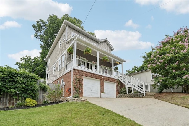 218 S Ave SE, Atlanta, GA 30315 - view of front facade with a garage, concrete driveway, brick siding, a porch, and stairway