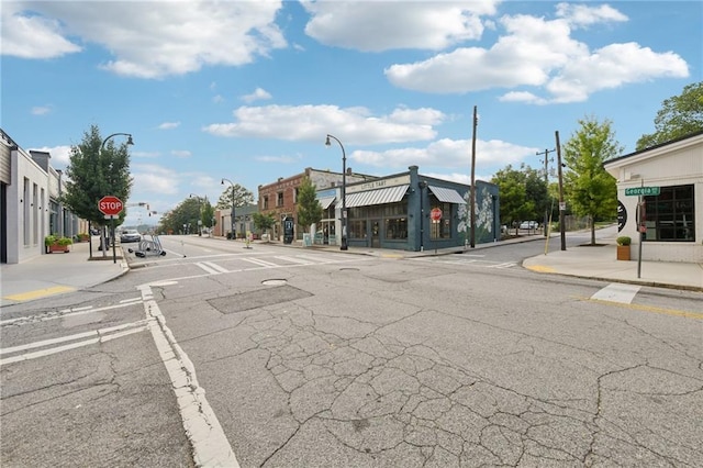 218 S Ave SE, Atlanta, GA 30315 - view of asphalt road featuring sidewalks, traffic signs, street lights, and curbs