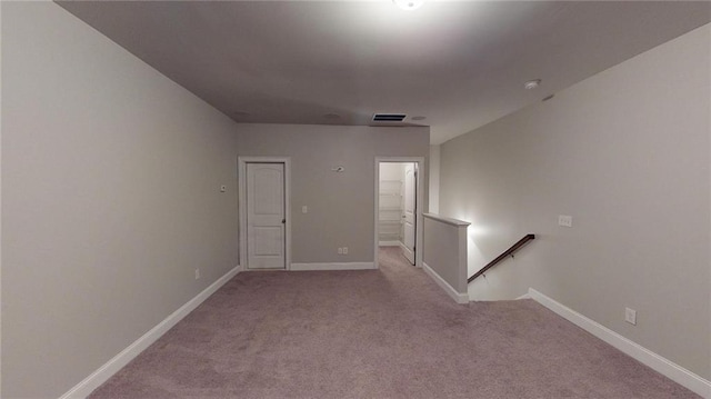 empty room featuring light colored carpet