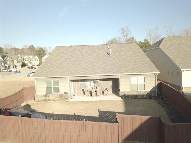 back of property with a patio area