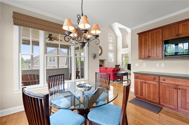 541 Brown Dr, Clermont, GA 30527 - dining space with baseboards, light wood-type flooring, ornamental molding, and a chandelier