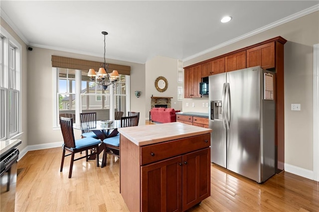 541 Brown Dr, Clermont, GA 30527 - kitchen featuring stainless steel refrigerator with ice dispenser, light wood-style flooring, a chandelier, light countertops, and baseboards