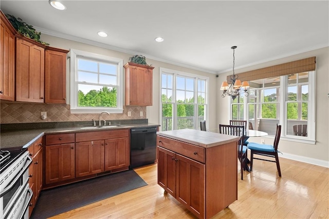 541 Brown Dr, Clermont, GA 30527 - kitchen featuring dishwasher, a sink, light wood finished floors, a chandelier, and stainless steel range oven