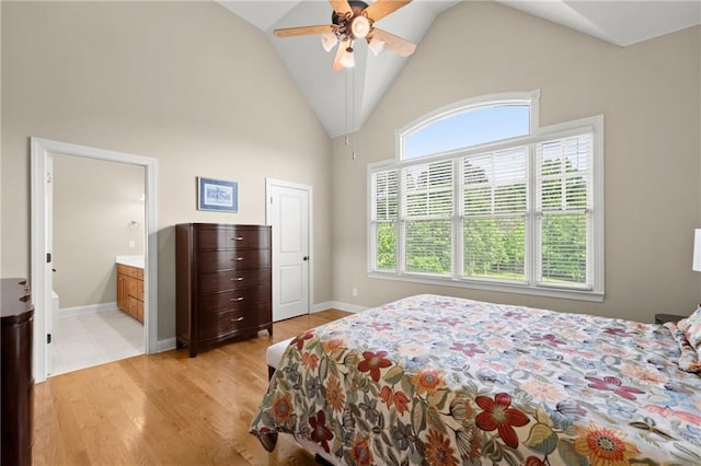 541 Brown Dr, Clermont, GA 30527 - bedroom featuring high vaulted ceiling, light wood-style flooring, connected bathroom, ceiling fan, and baseboards