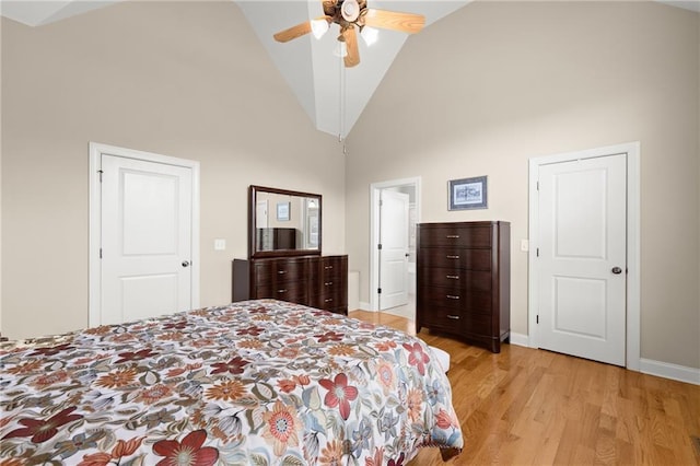 541 Brown Dr, Clermont, GA 30527 - bedroom with high vaulted ceiling, light wood finished floors, baseboards, and a ceiling fan