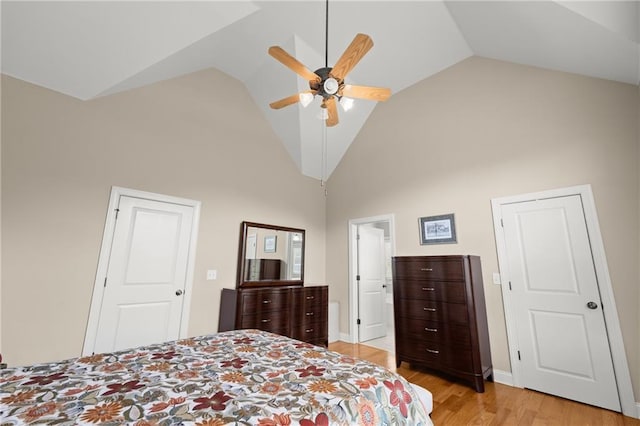 541 Brown Dr, Clermont, GA 30527 - bedroom with high vaulted ceiling, light wood-style flooring, and a ceiling fan