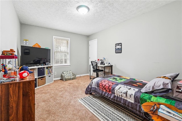 carpeted bedroom featuring baseboards and a textured ceiling