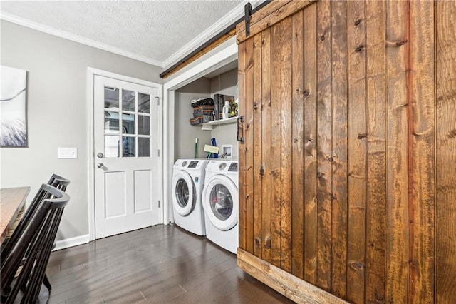 laundry area with crown molding, dark wood finished floors, laundry area, independent washer and dryer, and a textured ceiling