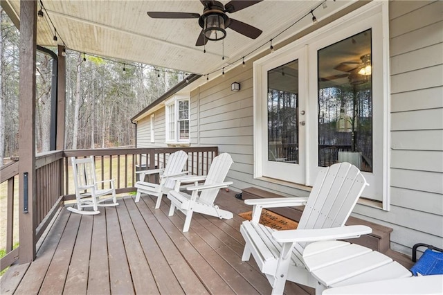 wooden deck featuring a ceiling fan