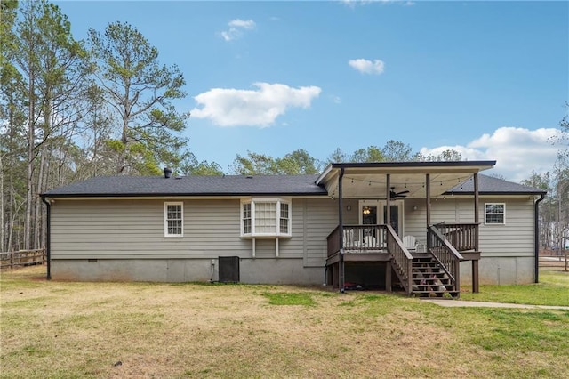 back of house with a lawn, a deck, a ceiling fan, stairway, and cooling unit