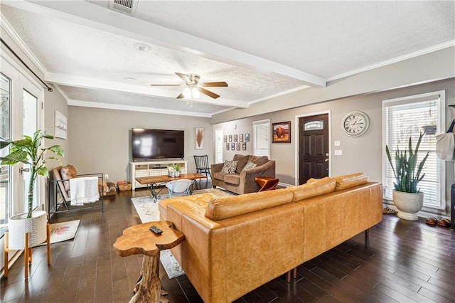 living room featuring dark wood-style floors, visible vents, beam ceiling, ceiling fan, and crown molding