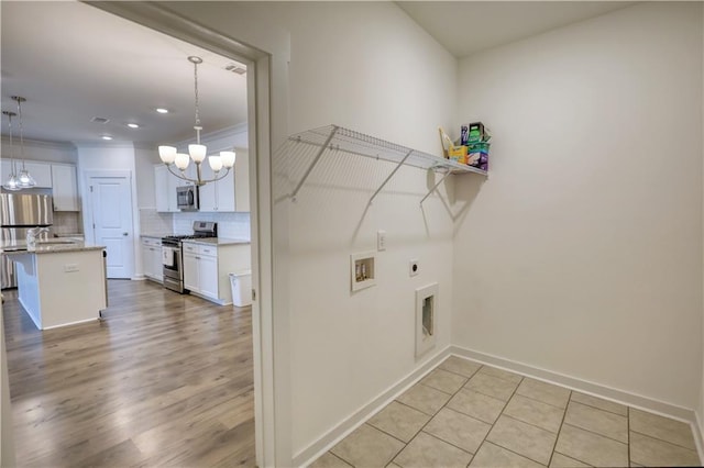 2929 Rambler Dr, Loganville, GA 30052 - laundry room with hookup for an electric dryer, washer hookup, a chandelier, baseboards, and recessed lighting