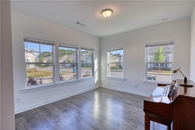 2929 Rambler Dr, Loganville, GA 30052 - unfurnished room with plenty of natural light, dark wood-style flooring, and baseboards