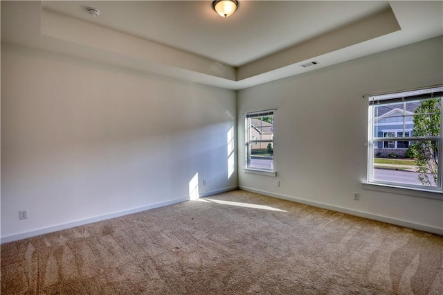2929 Rambler Dr, Loganville, GA 30052 - empty room with a raised ceiling, carpet, baseboards, and a smoke detector