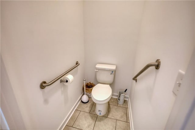 2929 Rambler Dr, Loganville, GA 30052 - bathroom with toilet, tile patterned floors, and baseboards