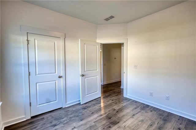 2929 Rambler Dr, Loganville, GA 30052 - unfurnished bedroom featuring wood finished floors and baseboards
