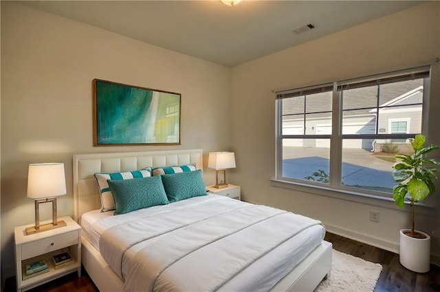 2929 Rambler Dr, Loganville, GA 30052 - bedroom featuring baseboards and dark wood finished floors
