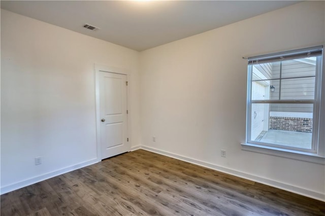 2929 Rambler Dr, Loganville, GA 30052 - unfurnished room with dark wood-type flooring and baseboards