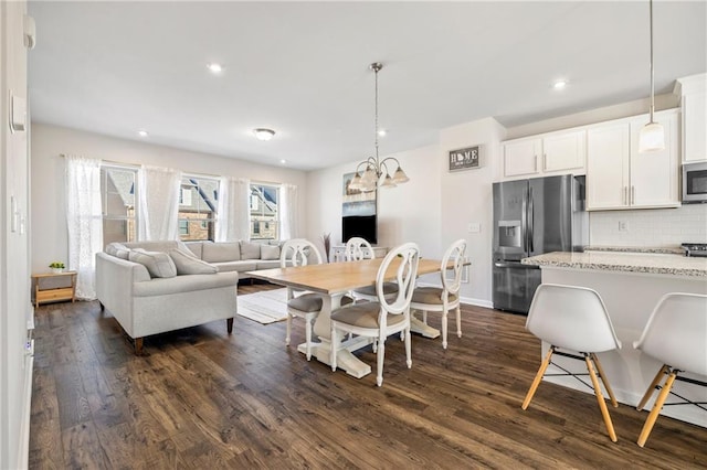 dining room featuring baseboards, recessed lighting, a chandelier, and dark wood-style floors