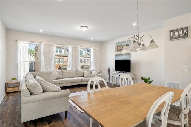 living area featuring visible vents, recessed lighting, a notable chandelier, and dark wood-style floors