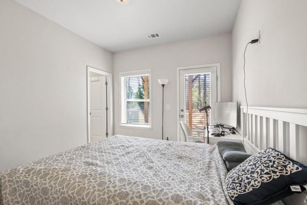 bedroom featuring visible vents and access to outside