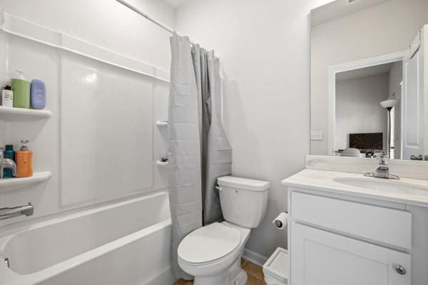 bathroom with shower / bath combo with shower curtain, vanity, and toilet