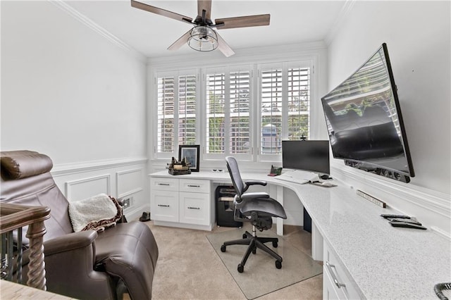 office space with light colored carpet, ceiling fan, and ornamental molding